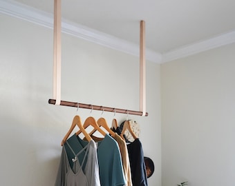 Leather straps for clothes rail hanging garment clothing rack nursery decor idea ceiling mounted laundry room drying rack modern farmhouse