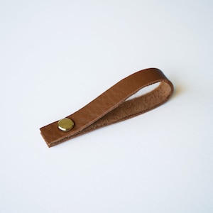 Saddle Brown natural Nicotine like color Sustainable Leather loop strap with brass Chicago screw closure, removable hanger for potholders, towels, oven mitts, trivets, keychains and more.