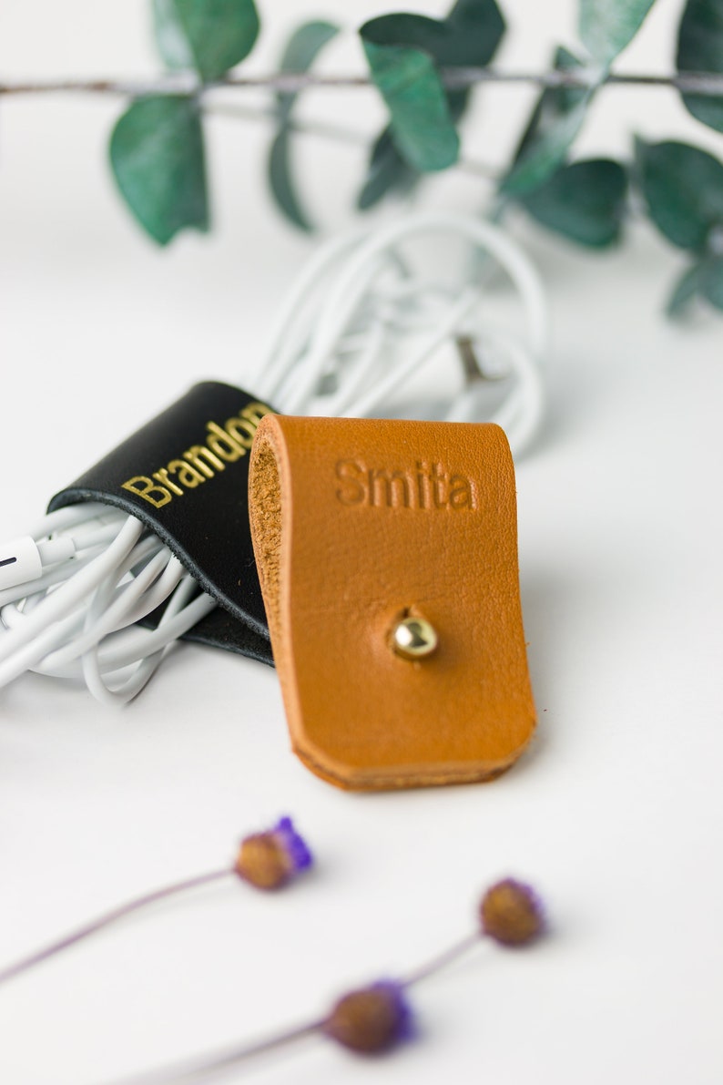 Closeup of Small Cord Holder with Imprinted lettering.