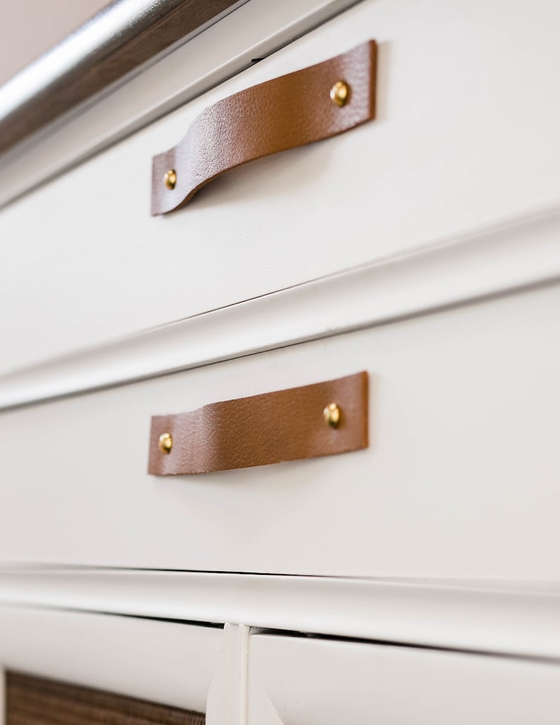 Leather Handles installed on a white dresser.