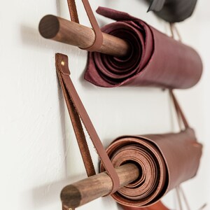 Large Wall Straps used with dowels to hang hides on a wall.
