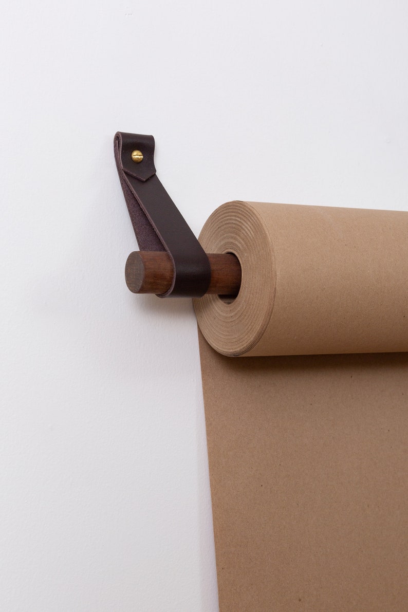 Closeup of the Leather Strap and Dowel which hold the Kraft Paper Roll.