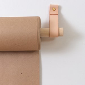 Keyaiira handcrafted Leather Strap and Birch wood Dowel which hold the Kraft Paper Roll.