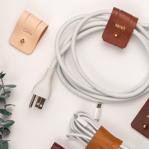 Leather Cable Holders displayed on a white background showing available colors.