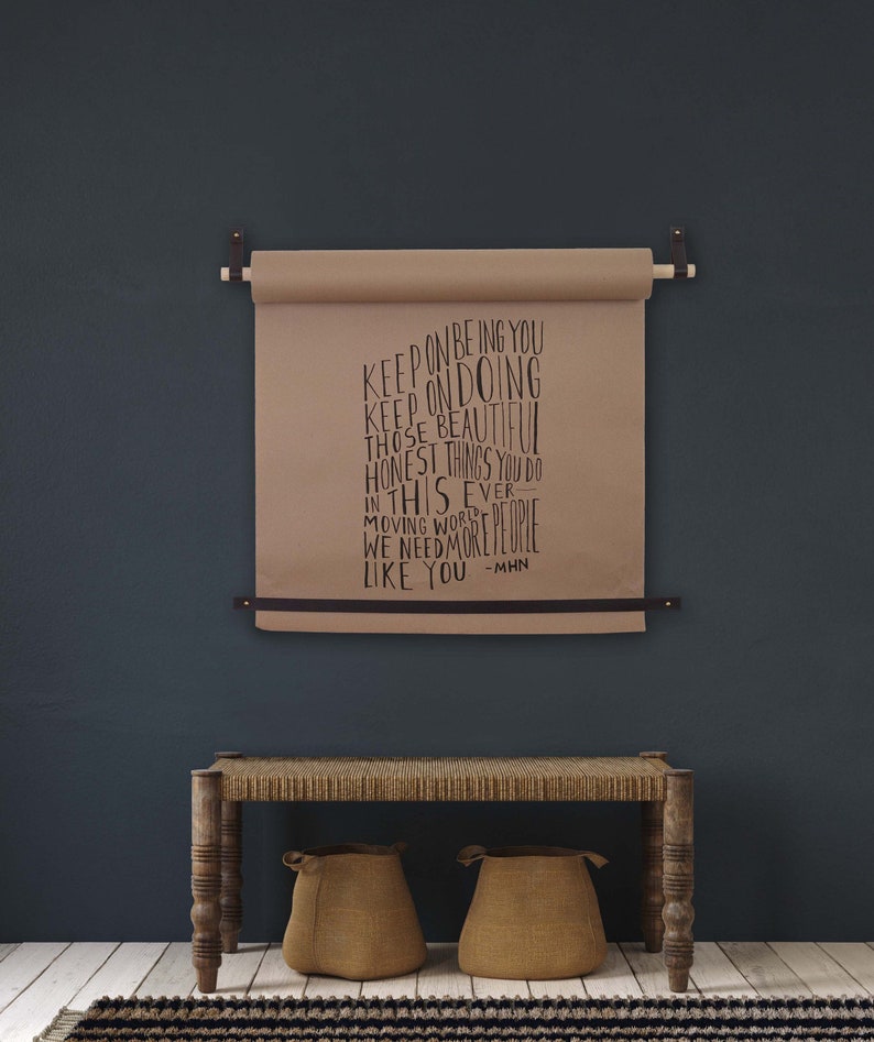 Keyaiira butcher paper roll hanger displaying notes hung with handcrafted leather straps, solid wood dowels, and modern farmhouse home decor styling.
