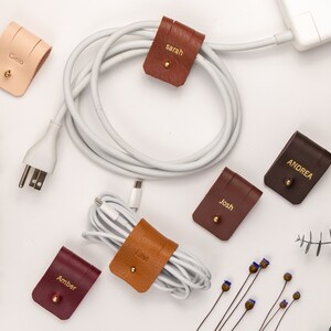 Leather Cable Holders displayed on a white background showing available colors.
