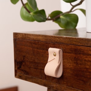 Closeup of a Small Wide Pull installed on a bedside table.