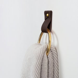 Leather Wall Strap installed and styled with a fluffy bathroom towel looped inside the metal ring.