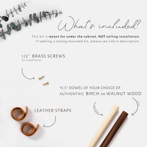 Guide showing the hardware that is included labeled with arrows pointing to the components on a white background. 
Mini screws lays flat alongside two leather straps and a dowel in your choice of Birch or Walnut wood.