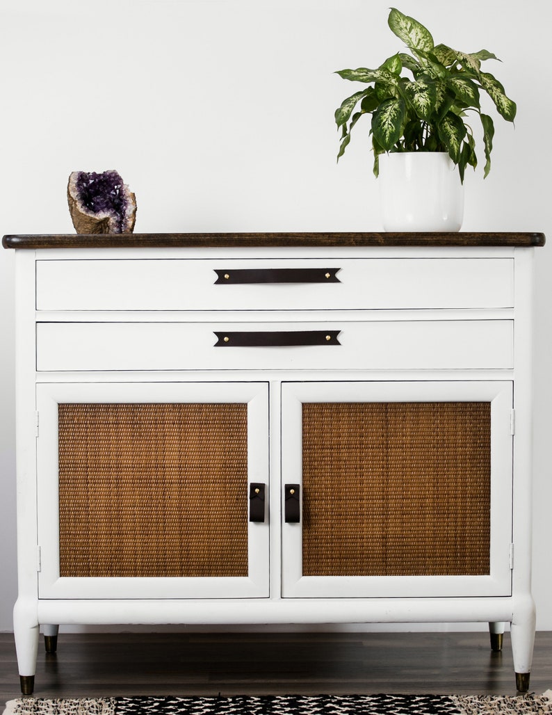 Leather Pulls installed on a white dresser on the bottom doors.