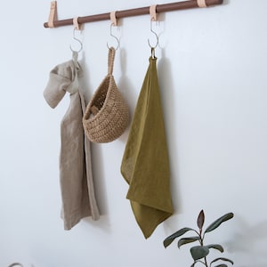 A Hanging Dowel Kit used to hang towels and other kitchen accessories from Steel O Hooks.