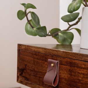 Closeup of a Small Wide Pull installed on a bedside table.