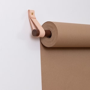 Keyaiira Leather Strap and Dowel closeup which hold the Kraft Paper Roll.