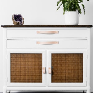 Leather Handles installed on a white dresser.