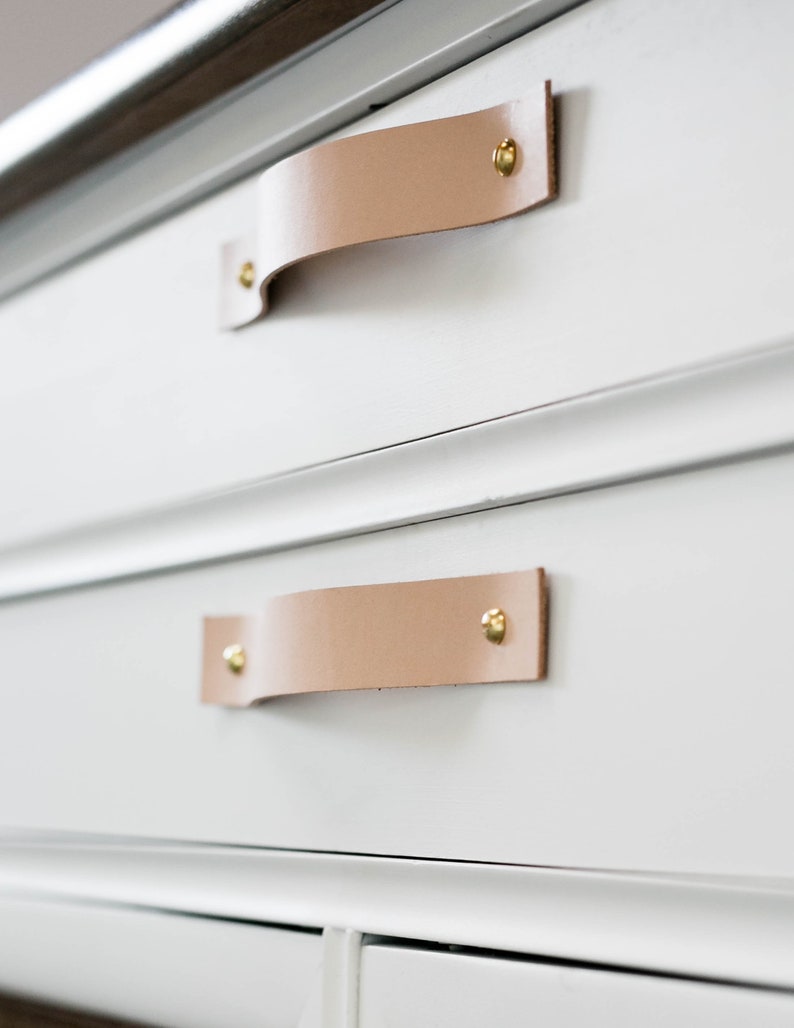 Leather Handles installed on a white dresser.