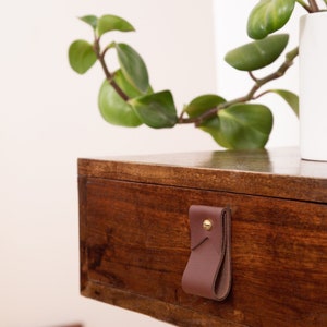 Closeup of a Small Wide Pull installed on a bedside table.