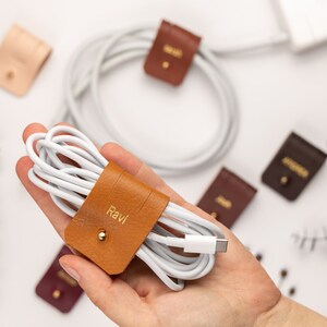 Leather Cable Holders displayed on a white background showing available colors.