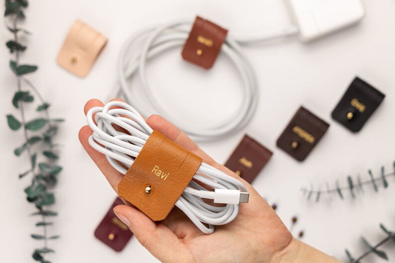 Leather Cable Holders displayed on a white background showing available colors.