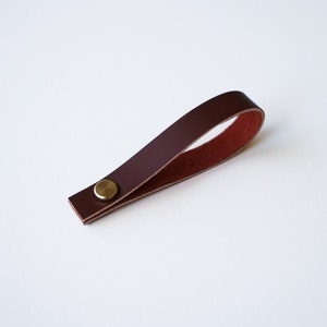 Mahogany Sustainable Leather loop strap with brass Chicago screw closure, removable hanger for potholders, towels, oven mitts, trivets, keychains and more.