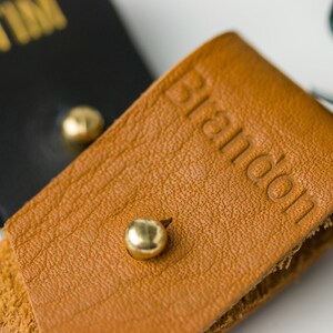 Closeup of Small Cord Holder with Imprinted lettering.