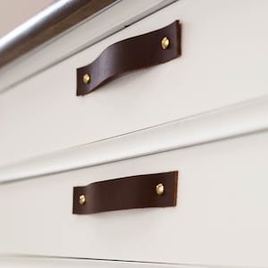 Leather Handles installed on a white dresser.