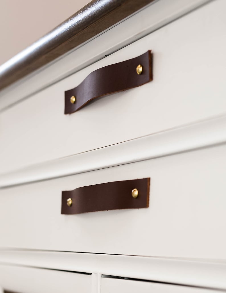 Leather Handles installed on a white dresser.