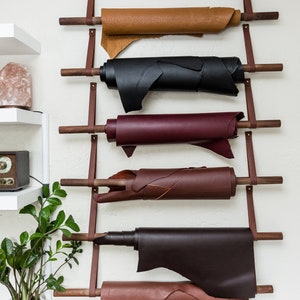 Large Wall Straps used with dowels to hang hides on a wall.