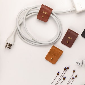 Leather Cable Holders displayed on a white background showing available colors.