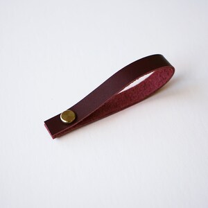Deep purple plum wine color Sustainable Leather loop strap with brass Chicago screw closure, removable hanger for potholders, towels, oven mitts, trivets, keychains and more.