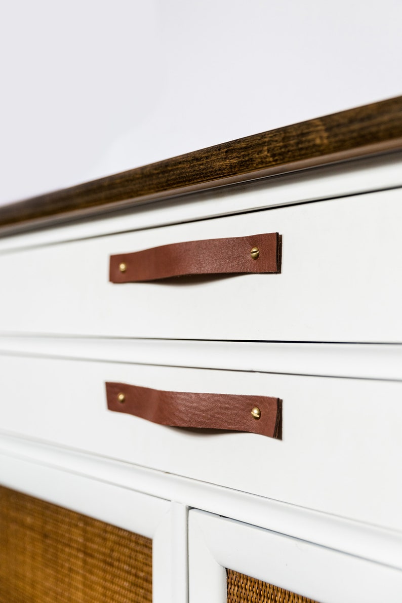 Leather Handles installed on a white dresser.