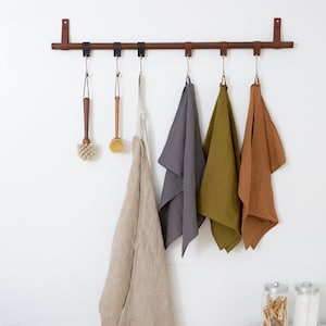 A Hanging Dowel Kit used to hang towels and other kitchen accessories from Metal Hooks & Leather Loops.