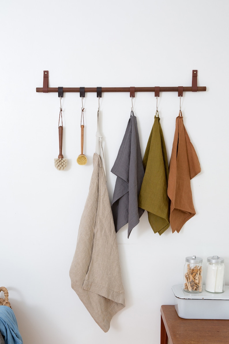 A Hanging Dowel Kit used to hang towels and other kitchen accessories from Metal Hooks & Leather Loops.