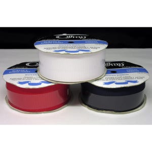 May include: Three spools of woven ribbon in white, red, and navy blue. Each spool has a label with the text "Woven Ribbon" and other text. The ribbon is suitable for apparel, craft, and floral applications.
