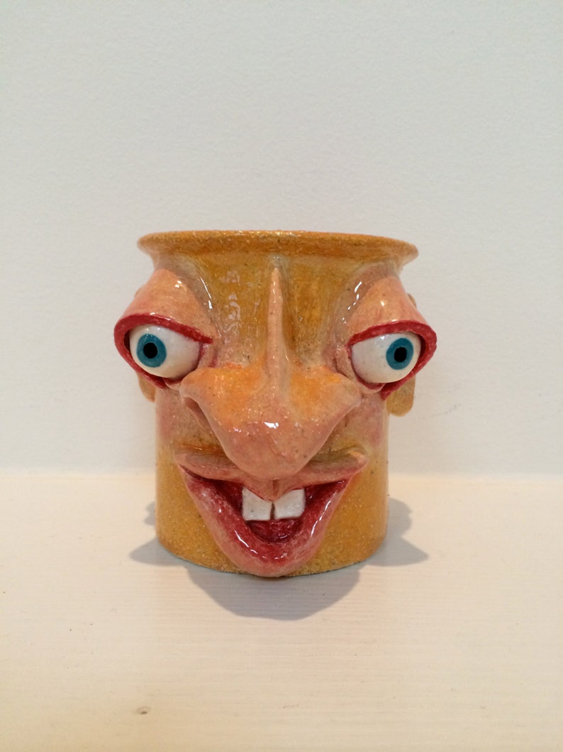 A hand built individually sculpted hand painted face pot in Etsy