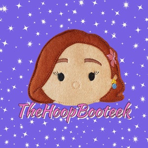 May include: A felt appliqué of a brown-haired girl with a pink flower in her hair. The girl has brown eyes and a light brown complexion. The background is a purple color with white stars.