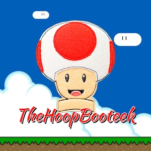 May include: A white and red mushroom character with a smiling face, against a blue sky with white clouds. The text "TheHoopBooteek" is below the character.
