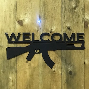Metal Rifle Welcome Sign