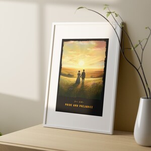 May include: A white framed print of a painting depicting a couple walking in a field at sunset. The painting is titled "Pride and Prejudice".