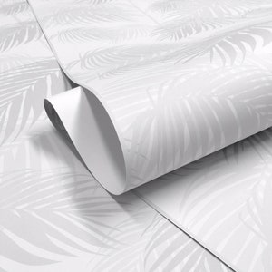 May include: White wrapping paper with a subtle embossed pattern of palm leaves.