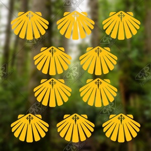 May include: Nine yellow scallop shell stickers with a cross in the center. The stickers are arranged in a grid pattern on a green background.