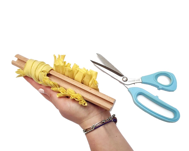 How to use a wooden gauge to cut fabric strips for proggy, shaggy and clippy rag rugs, eco-friendly crafting tool for upcycling textiles. Ragged Life cutting block.
