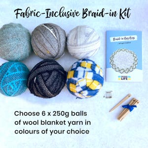 May include: A Fabric-Inclusive Braid-in Kit featuring six 250g balls of wool blanket yarn in shades of blue, grey, and yellow. The kit includes a booklet, pins, and wooden tools for making braid-in rag rugs. The text reads "Fabric-Inclusive Braid-in Kit" and "Braid-in Rag Rugs".