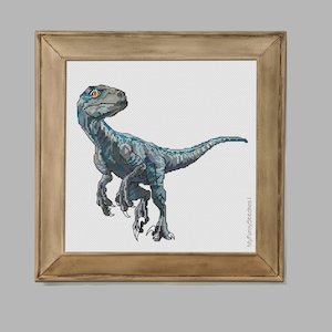 May include: A cross-stitch embroidery of a blue velociraptor with yellow eyes, set within a square wooden frame. The dinosaur is depicted in profile, facing left, with sharp claws and textured scales. The text MyFunnyStitches is visible.