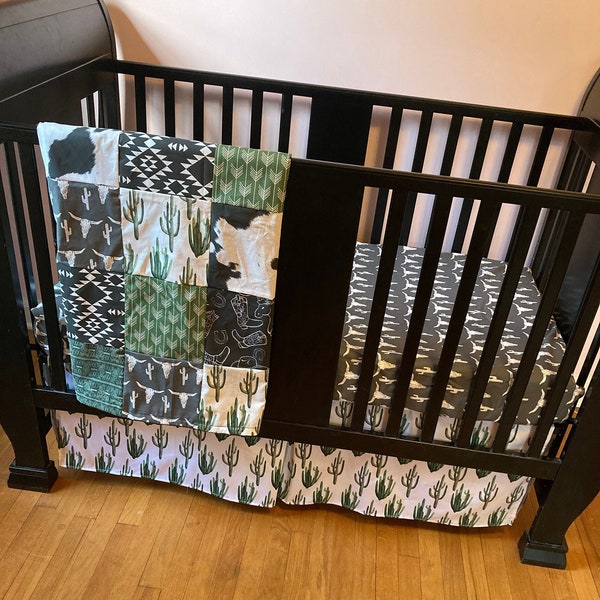 Made to Order Baby Bedding with a western boho theme with cactus, cow, and Aztec prints in dark green, gray and black