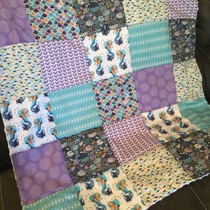 Custom Made to Order Baby Blanket in purple and turquoise with an underwater mermaid theme featuring mermaid scales, fish and coral reef