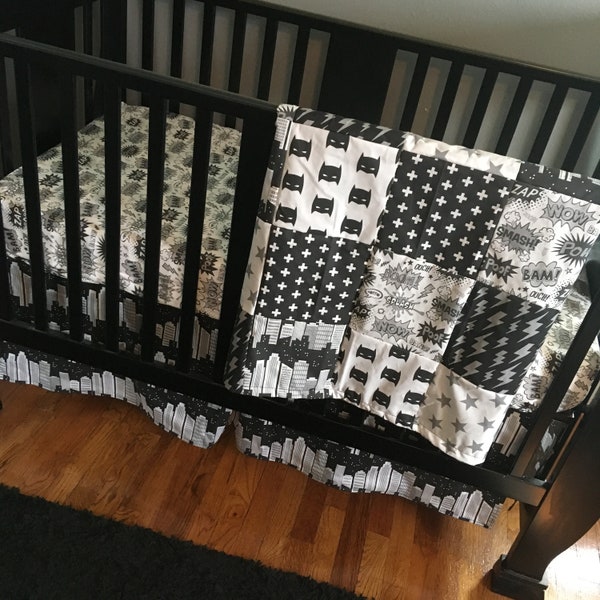 Superhero Baby Boy Bedding in mono chrome black gray and white with comic book bubbles, sky scrapers and super hero fabrics
