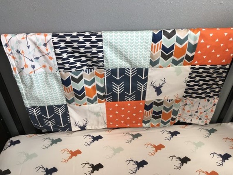 chevron and Aztec fabrics navy and mint with a modern woodland theme including deer Custom made to order baby blanket in orange arrows