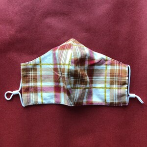 White Festive Flannel Elastic Facemask with Nose Wire, Filter Pocket, + Adjustable Elastic