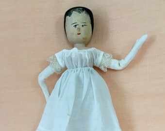 Myrtle, an antique doll, fully recovered from surgery