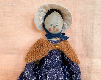 Hannah, an antique doll, fully recovered from shoulder surgery